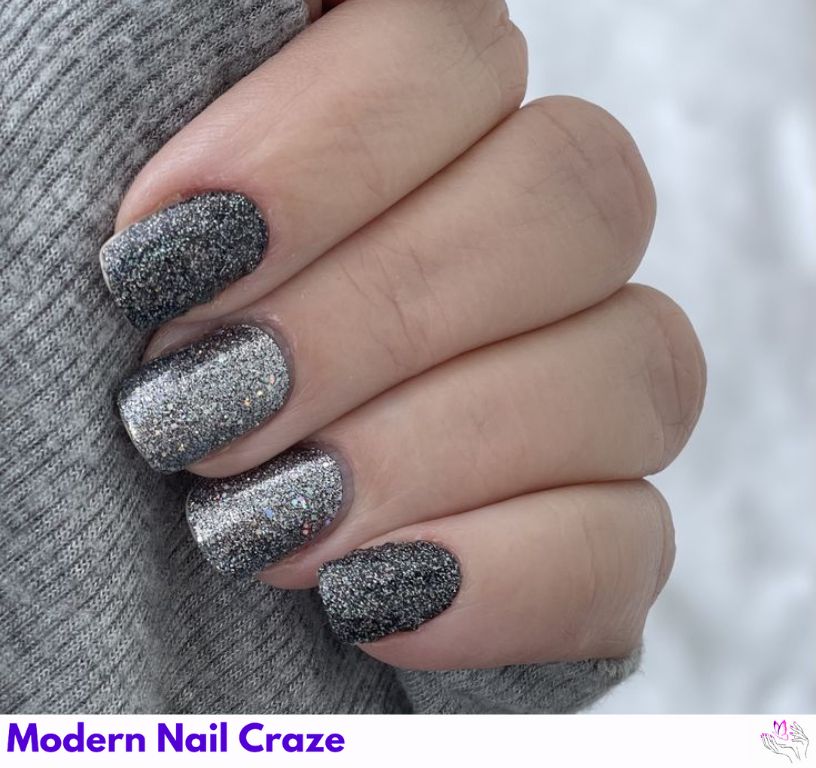 Medium-tone gray nails with embedded fine silver glitter for holidays.