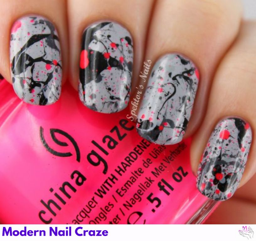 Matte gray nails with bright neon splatter paint accents for a bold look.
