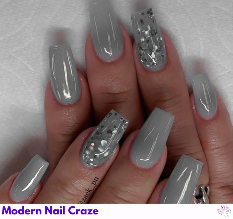 Icy platinum gray nails with high-contrast shine on almond shapes.