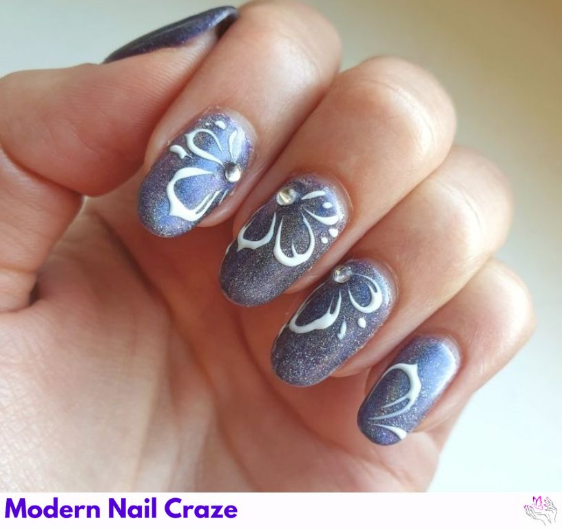Gray base nails with 3D sculpted white and blush flowers.