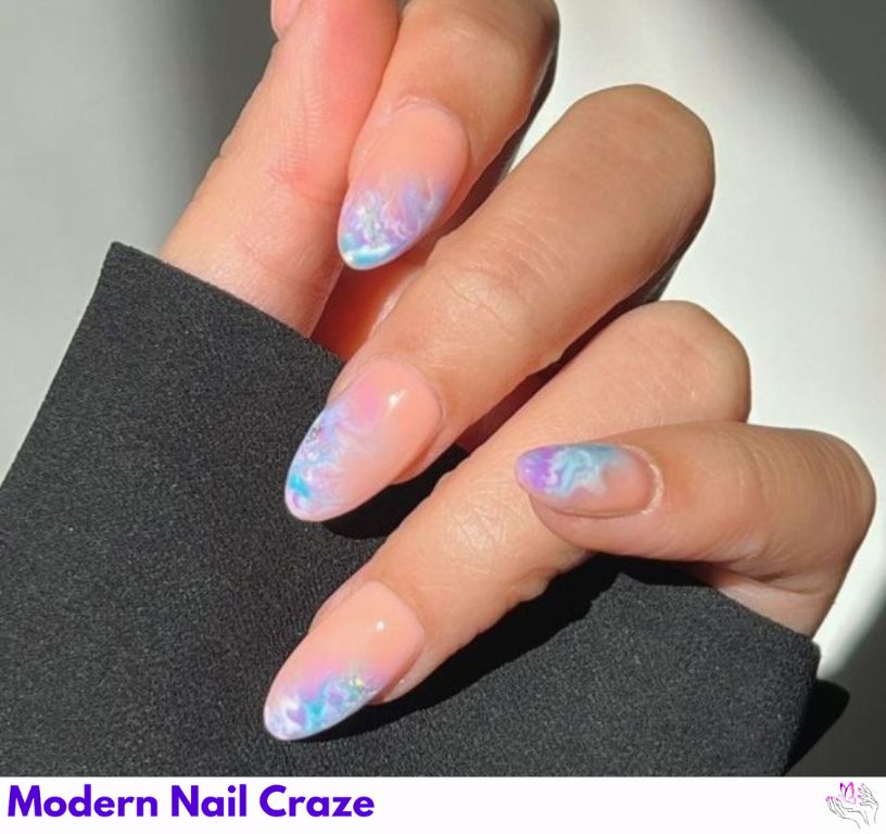 Little Mermaid-inspired nails with blues and purples for a mesmerizing effect.