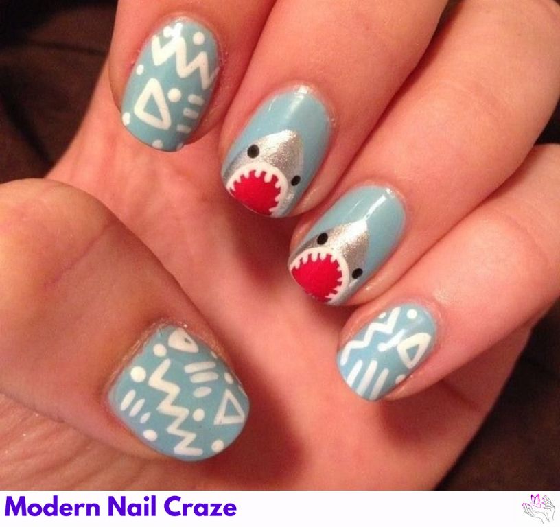 Bold shark-inspired mermaid nails with intricate ocean designs.