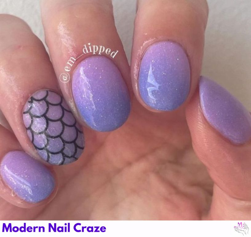Stylish ombre mermaid tail nails with a bold summer look.