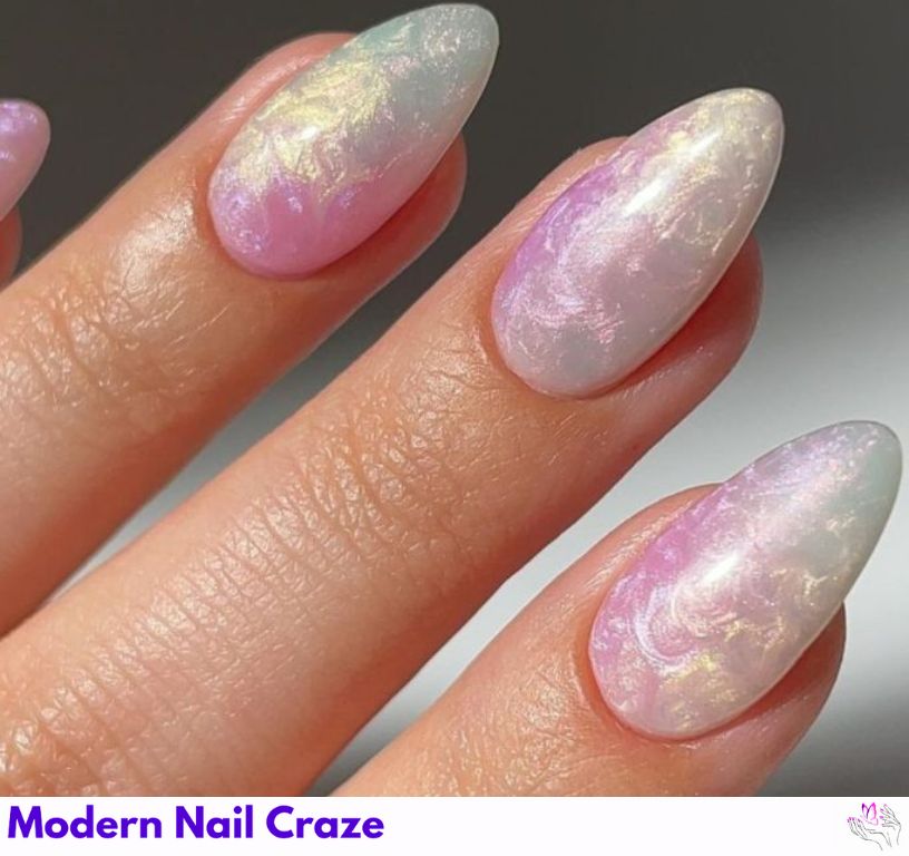 Elegant swirly mermaid nails with a timeless pearl effect.