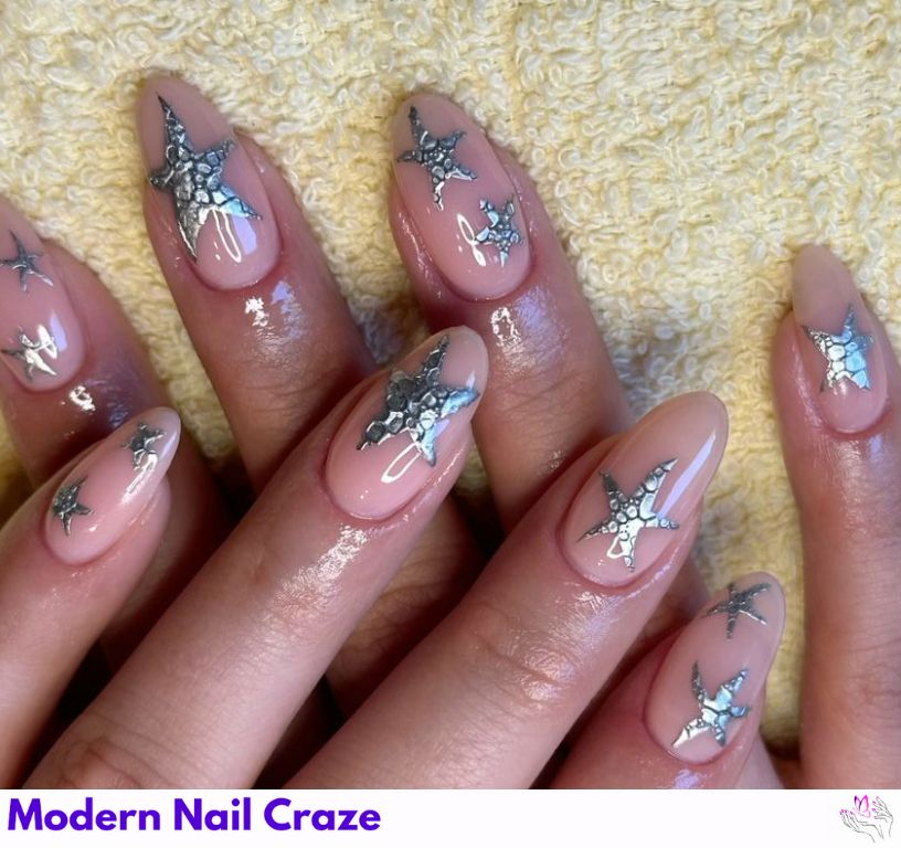 Starfish-accented mermaid nails with soft blues and elegant details.