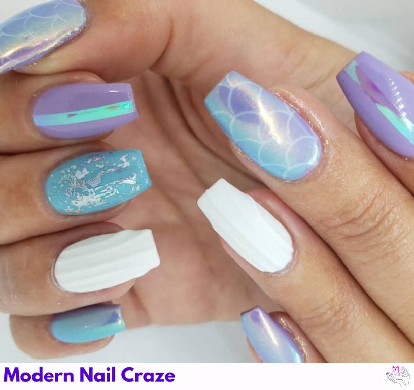 Shimmering mermaid nails with scales, seashells, and iridescent hues.
