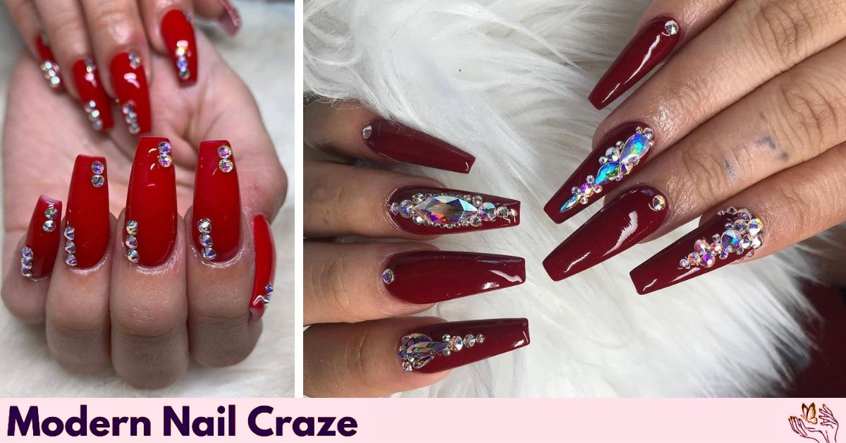 Red coffin nail decorated with rhinestones and gems near the cuticle.