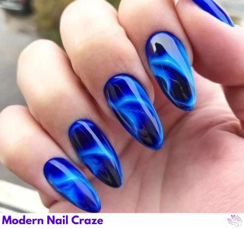Electric blue almond nails with a vibrant glossy finish for drama.