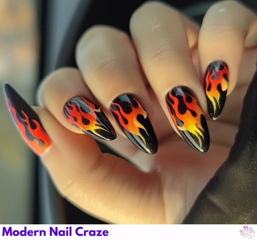 Flames almond nail design with red and orange fire tips, edgy.