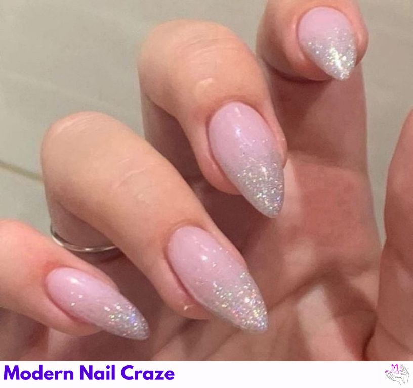Floating glitter almond nails with sparkly flecks in a clear base.