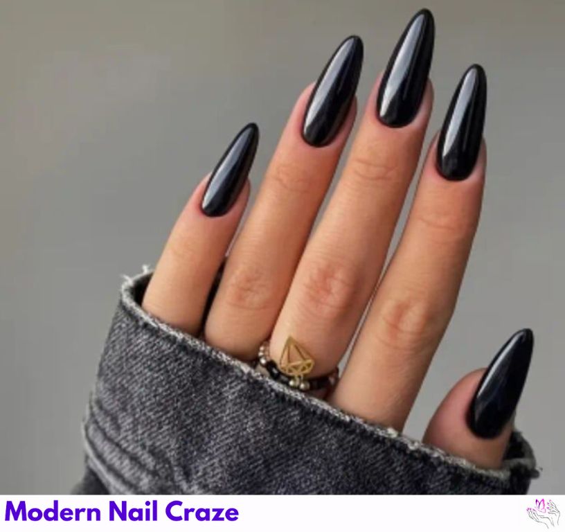 Glossy black almond nails with a mirror-like shine, elegant and bold.