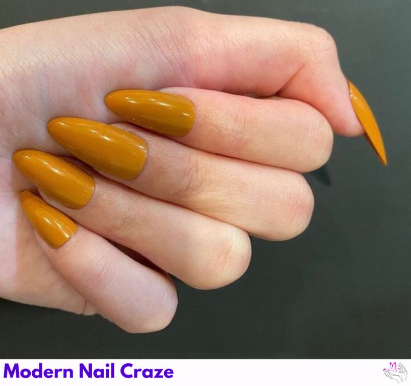 Matte mustard almond nails in warm yellow tones, trendy for fall.