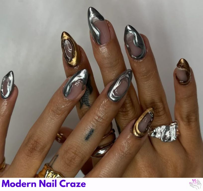 Metallic foil almond nails with gold flakes and sheer base.