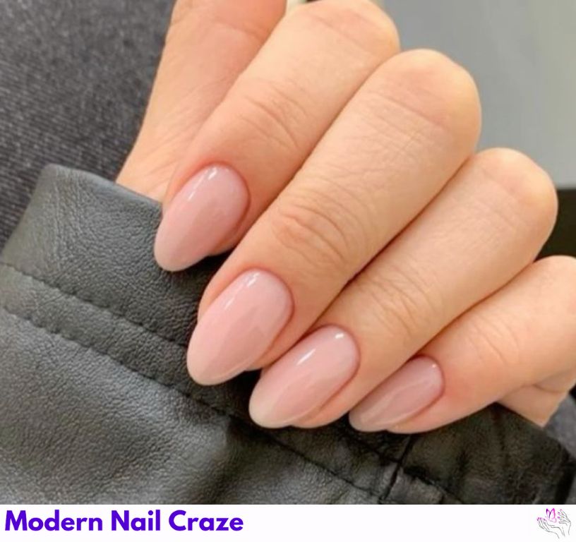 Nude short almond nails with a glossy nude finish, natural and simple.