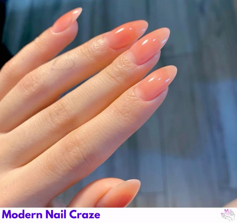 Peachy nude almond nails for a soft and feminine natural look.