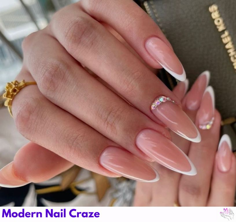 Thin French almond nails with slim white tips and pink base.