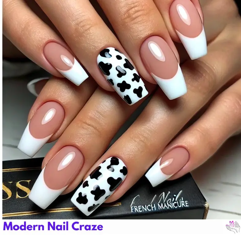 Quirky cow print on French nails, blending tradition with a modern twist.
