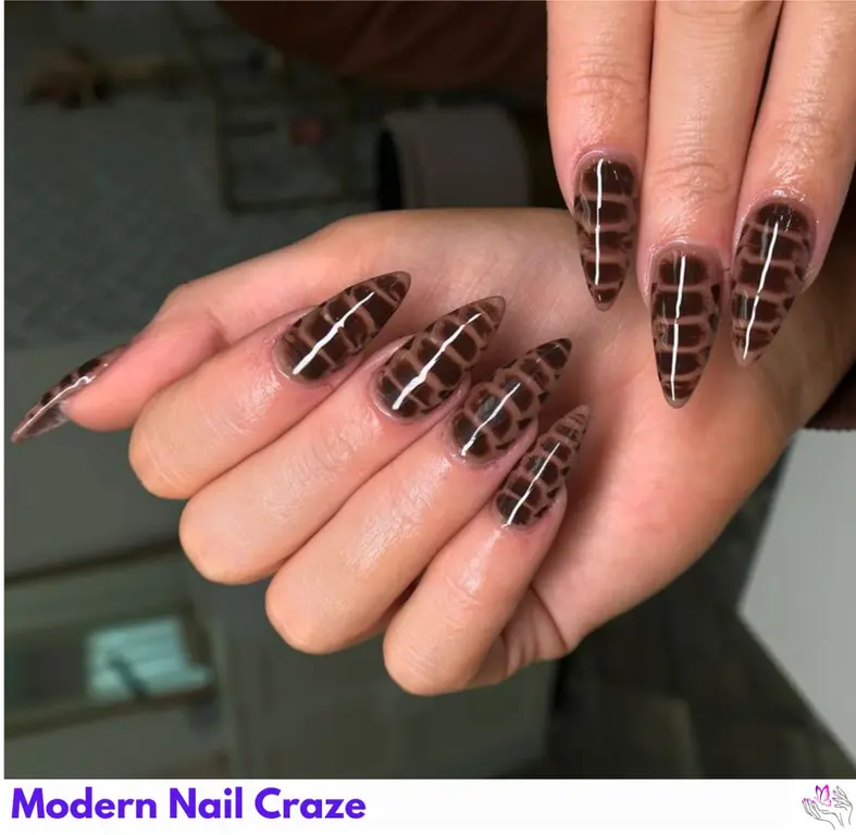 Refined croc print nails in dark tones, offering a sleek and sophisticated animal-inspired look.