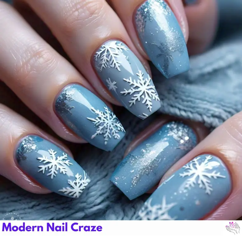 Classy frosty sky blue nails with embossed snowflakes and French tips, creating a sophisticated winter wonderland design for the season.