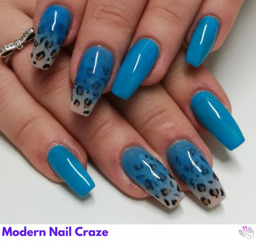 Stylish glossy blue leopard print nails with confetti accents, offering a fun and bold look.