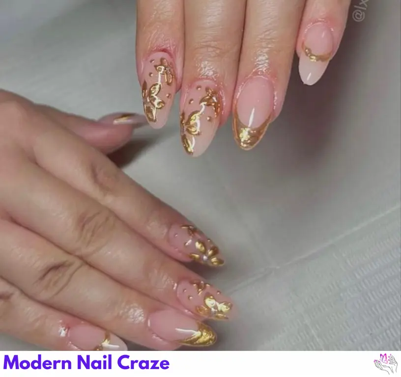 Luxurious gold chrome nails combined with watercolor flowers for an elegant, artistic manicure.