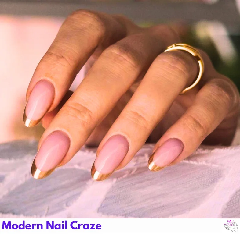 Golden Chrome French Nails with metallic finish and star-shaped rhinestones for a glamorous twist on the classic French tip.