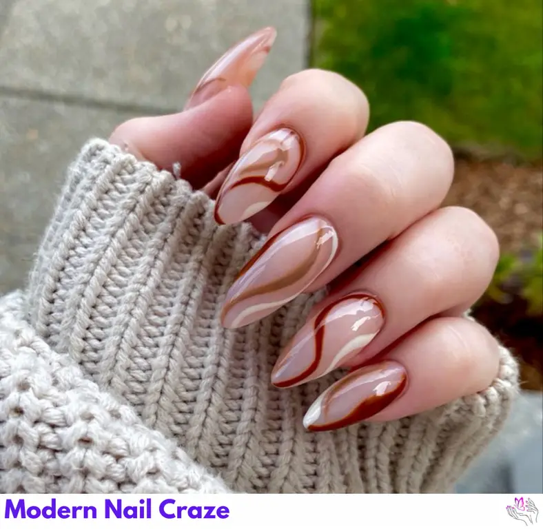 Latte Swirl Nails featuring coffee-brown patterns on a white base, offering a cozy and quirky nail design with movement and depth.