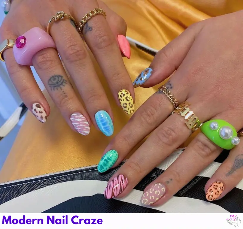 Fun and festive mix’n’match animal prints for a colorful and creative holiday nail design.