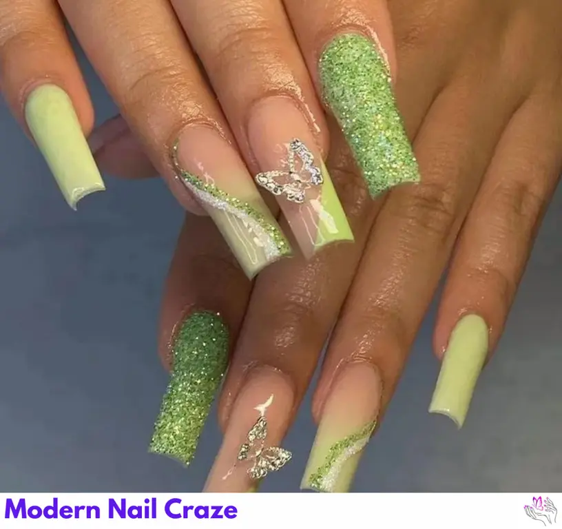 Delicate peach fuzz butterfly nails with green V-shaped tips, creating a whimsical and elegant spring look.