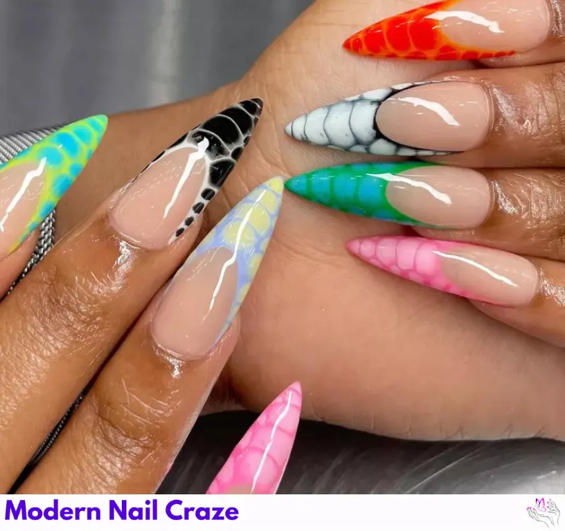 Fierce stiletto nails with multicolored snake print, giving a sharp, bold edge to your dramatic animal print style.