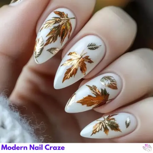 Autumn-inspired Thanksgiving nails featuring warm shades of orange, gold, and brown, with leaf and pumpkin designs.