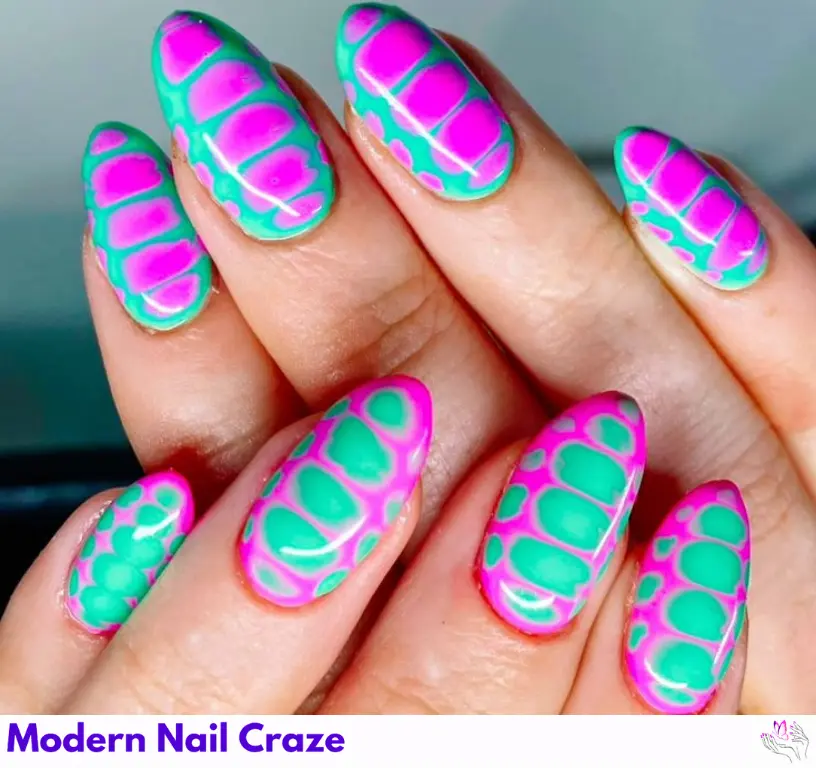 Vibrant snake print nails in magenta and green, creating a bold, eye-catching design with a touch of intrigue.