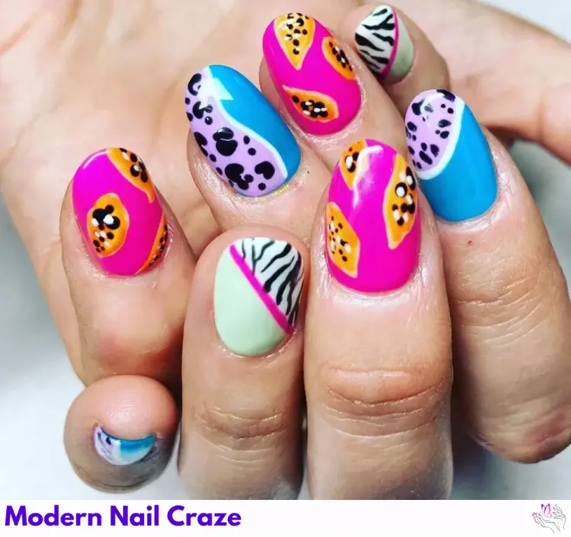 Creative zebra print mismatched nails in papaya colors, adding a fun and abstract twist to your nail design.