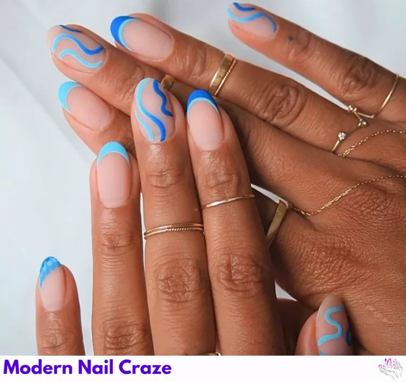 Minimalist French nails with vibrant blue and swirl art.