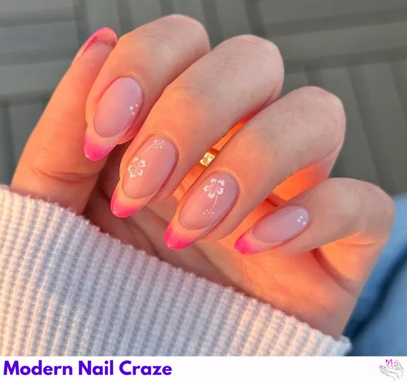 Sherbet orange nails with coral and hibiscus accents.