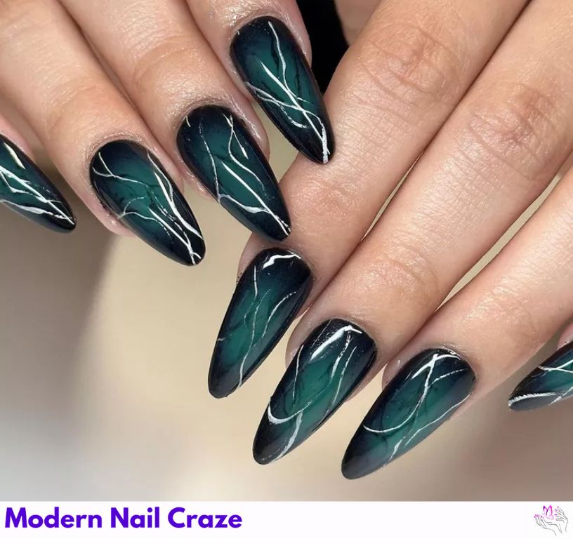 Dark Teal Lightning Nails: Spooky teal chrome nails with silver lightning streaks.