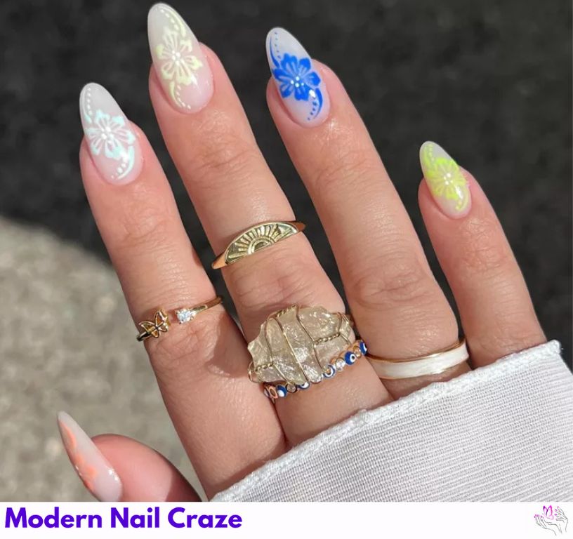 Citrus-inspired nails with hibiscus flowers and white details.