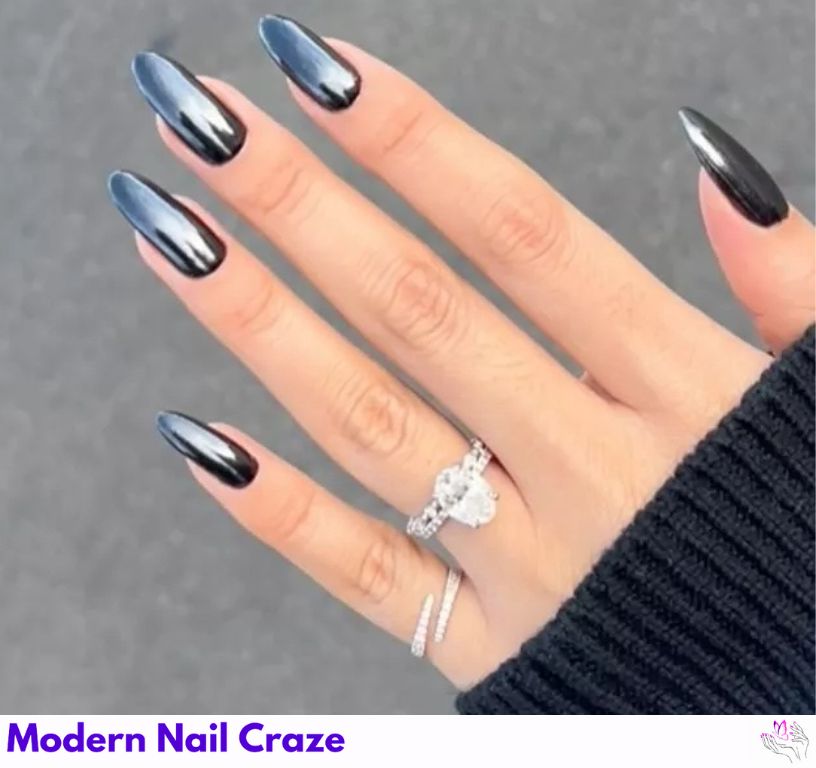 Sleek glazed black nails with white chrome powder.