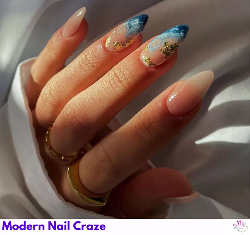 Luxe Foil: Glamorous gold foil nails with a marbled ocean swirl.
