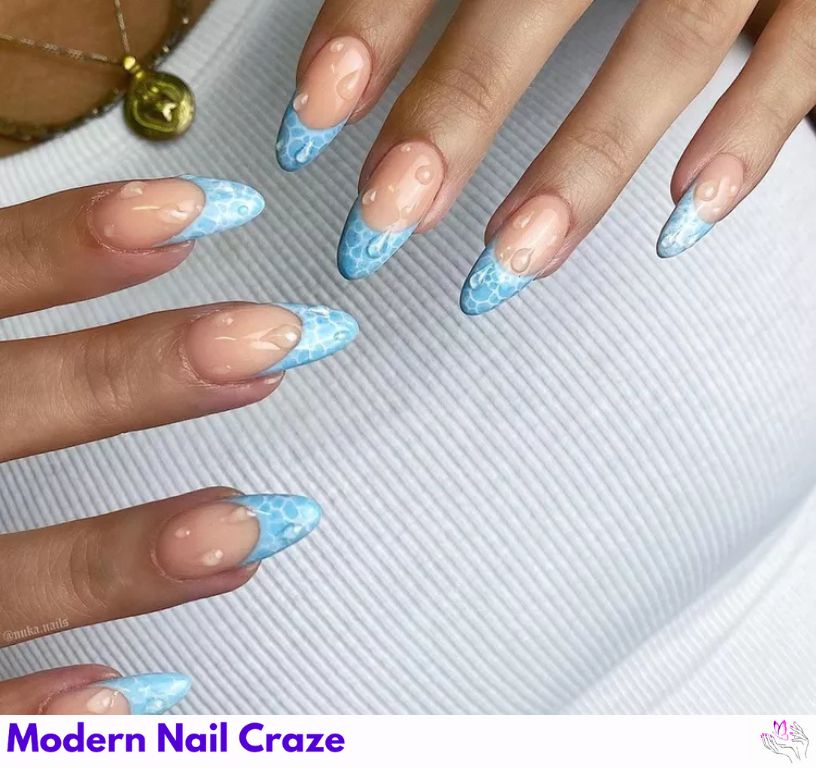 Make a Splash: Underwater-themed nails with blue and white light reflections.