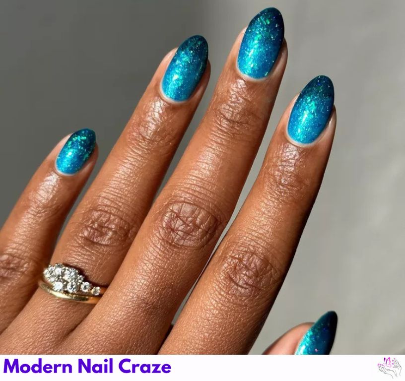 Glittery ocean ombré nails capturing sea depths and colors.