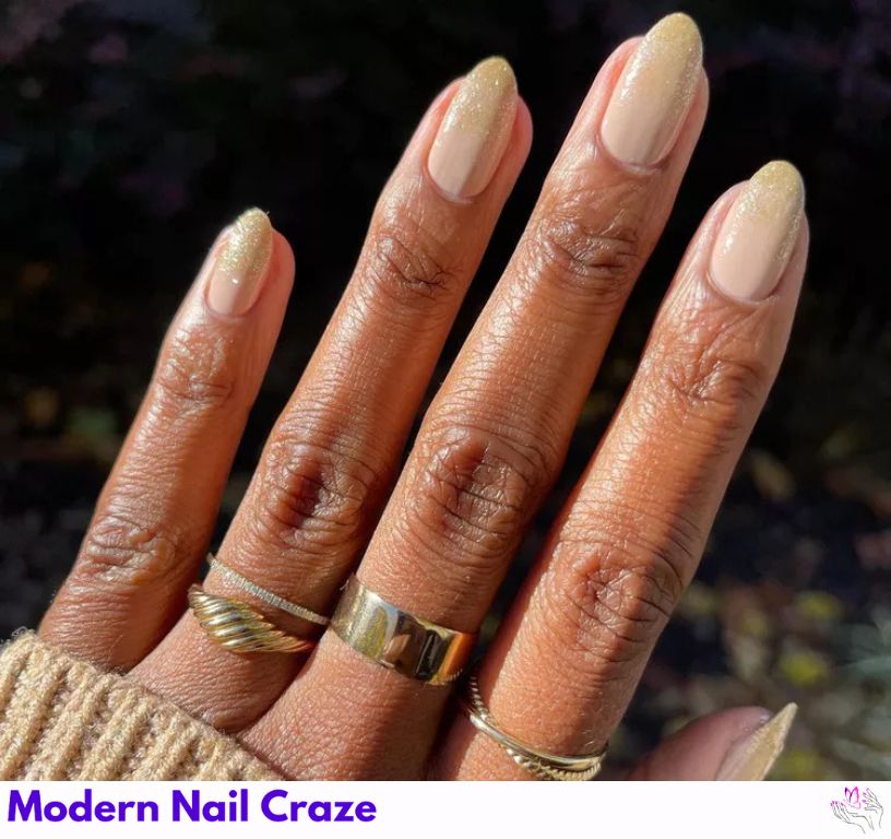 Shimmer Sand Ombré Nails: Subtle beach-inspired ombré nails with glitter.