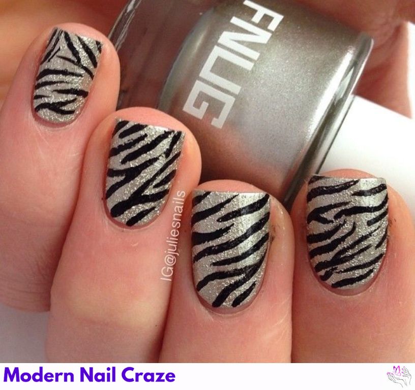 Precise silver striped accent over a smooth gray nail base for a festive vibe.