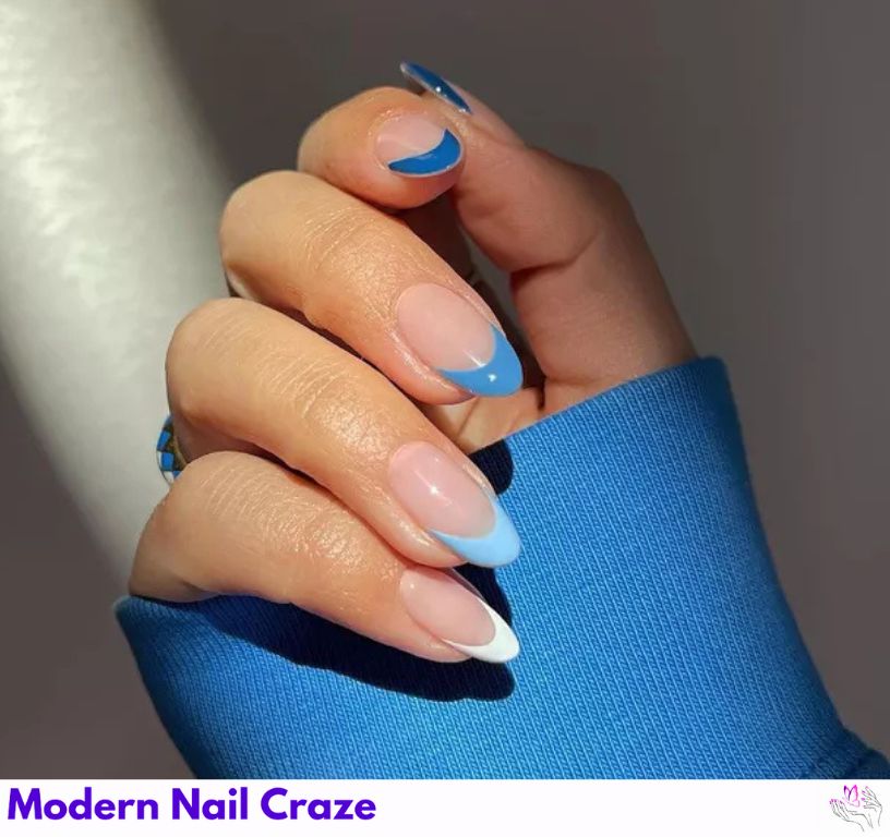 Chic ombré blue French nails with seamlessly blended shades.