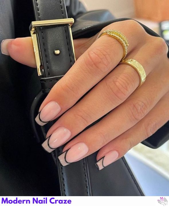 French manicure with bold black cutout details.