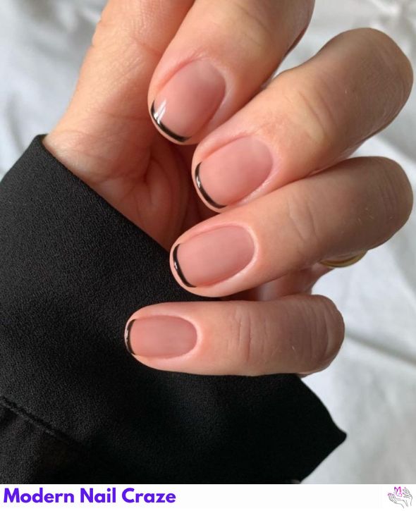 Classic French nails with elegant black tips.