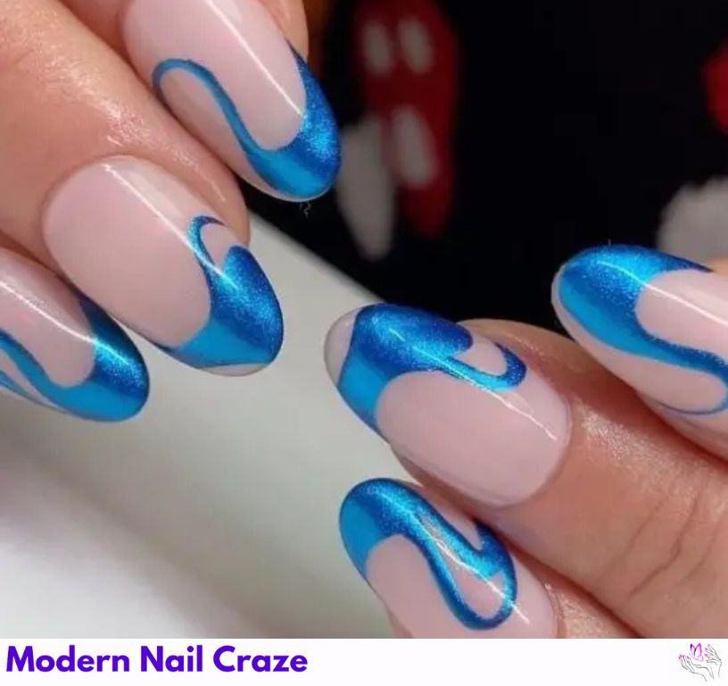 Swirly blue French nails with a glossy chrome effect.
