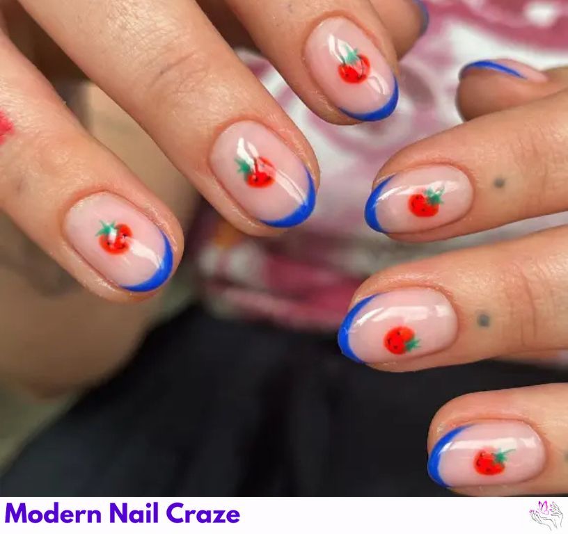 Quirky blue French nails featuring a tomato-themed design.