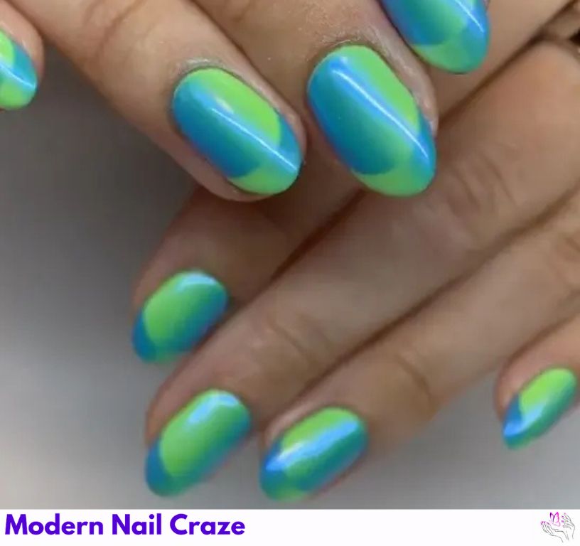 Trendy blue French nails featuring a green ombré chrome look.