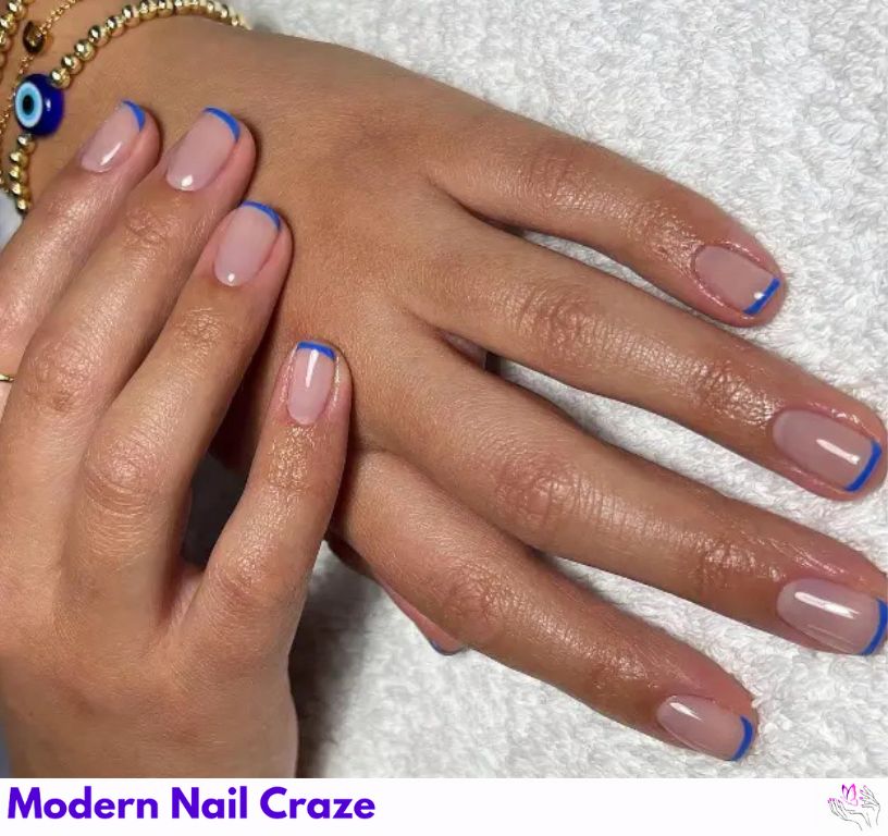 Sleek short blue French nails with a gel polish finish.